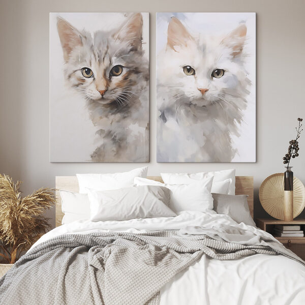 Two cats with their heads turned to the side