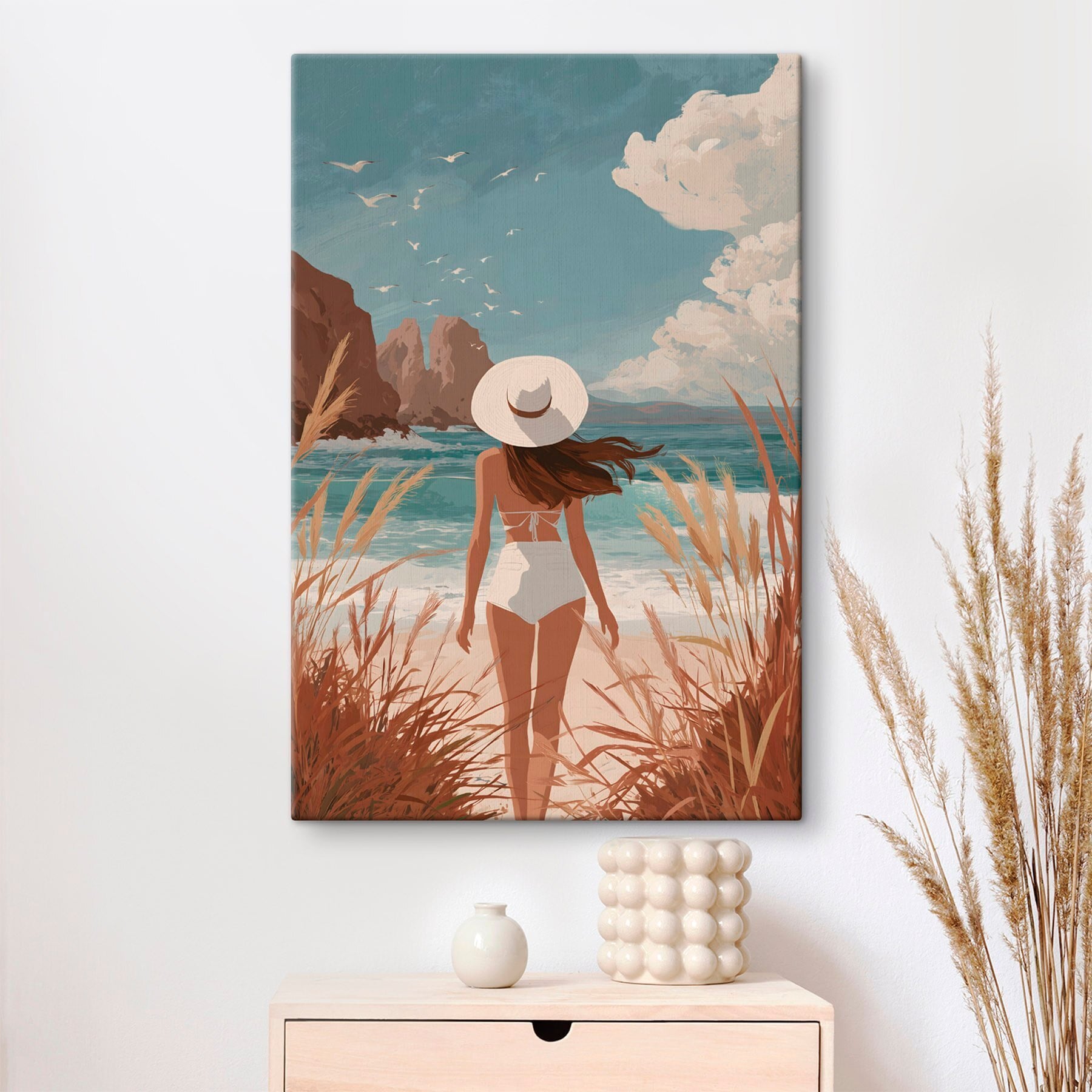 Woman in a swimsuit and hat walking on a beach